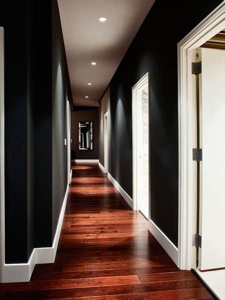 The contrast between the black ceiling paired with light colored walls the white ceiling creates an open, bright space. HOME DZINE | Fade to black... Decorating with black