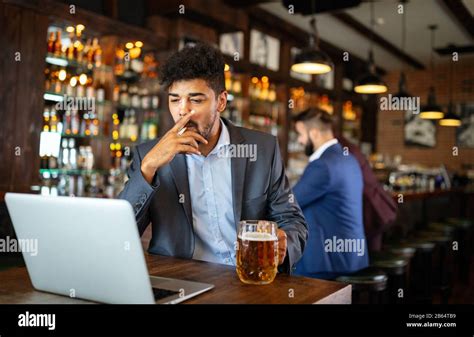 People And Bad Habits Concept Man Drinking Beer And Smoking Cigarette