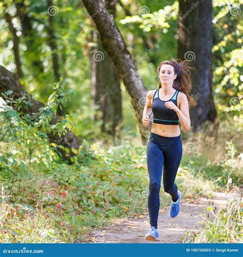 Young Smiling Woman Running In Park In The Morning Stock Image Image
