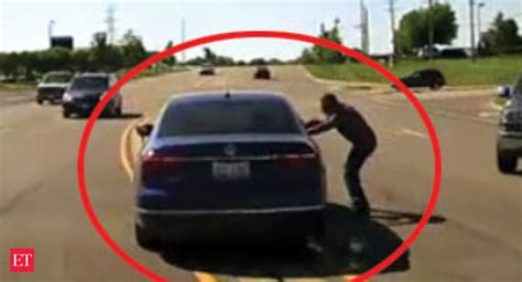 Watch Man Jumps Into Moving Car Saves Seizure Victim The Economic Times Video Et Tv