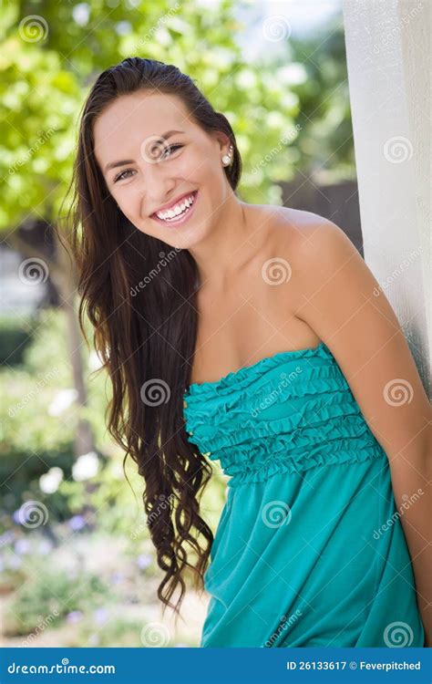 Attractive Mixed Race Teen Girl Portrait Laying In Grass Stock Photo