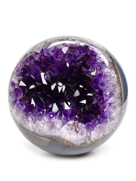 A Purple And White Object With Lots Of Crystals In It