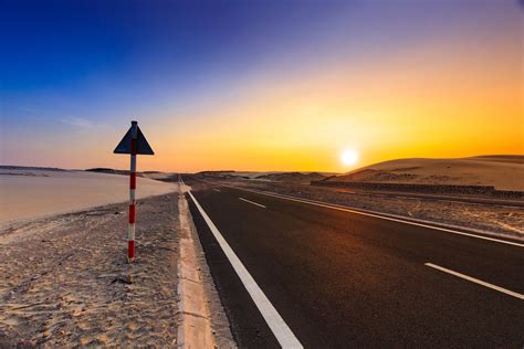 Empty Road During Sunset · Free Stock Photo