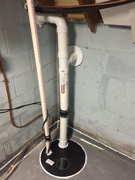 Mystery pipe in basement floor. Golden Valley - 06/11/2015 - Minnesota Radon Mitigation