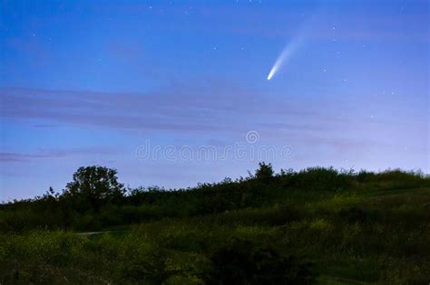 Meteor Shooting Star Or Falling Star Seen In A Night Sky With Clouds