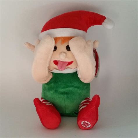 adorable animated elf plays peek a boo at the press of a button giggle all the way with this
