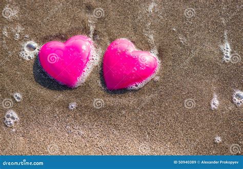 Two Red Hearts On The Beach Symbolizing Love Stock Image Image Of