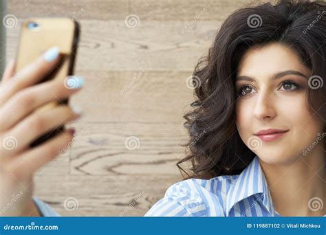 Pretty Girl Taking A Selfie Cute Brunette Girl With Gorgeous Curls On
