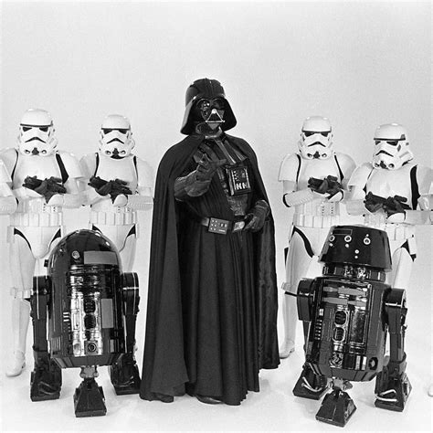 A Group Of Star Wars Characters Standing Next To Each Other