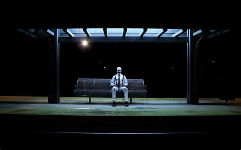 Man Sits On Bench Bus Stop During Nighttime Hd Wallpaper Wallpaper Flare