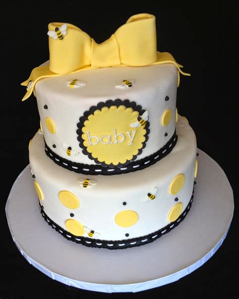 Create a fun baby block cake as the centerpiece of your table design. Bee Themed Baby Shower Cake