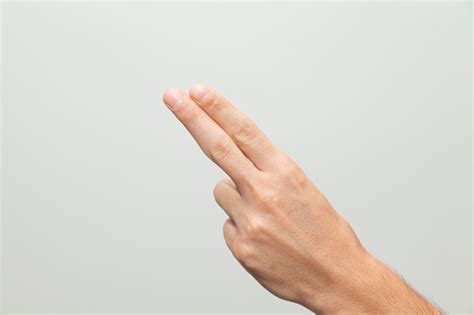Male Hand Holding Up Two Fingers Stock Photo Download Image Now Istock