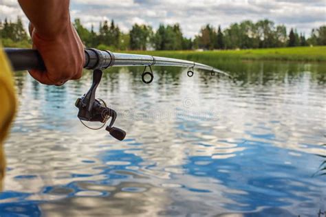 A Man With A Fishing Rod On The River Bank Stock Image Image Of Male