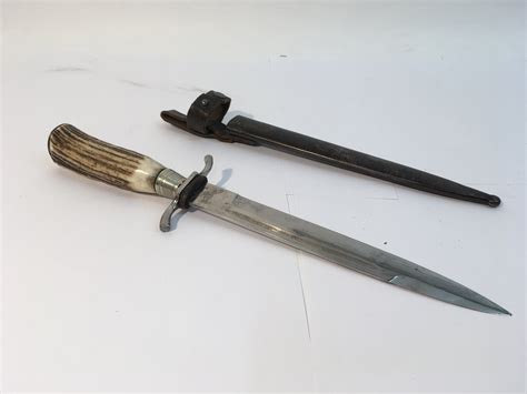 A Ww1 German Fighting Knife With Horn Handle A Bright Blade A Black
