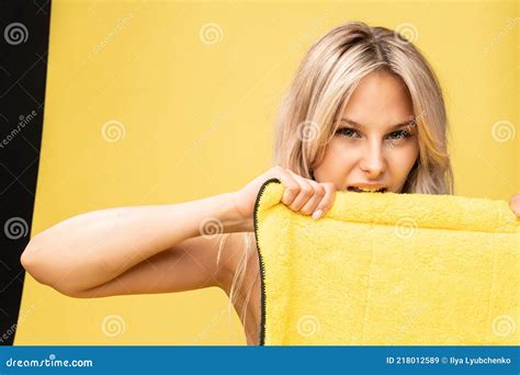 Girl Rips Rag With Her Hands Yellow On A Yellow Background Beautiful