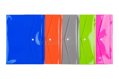 Five Multi Colored Plastic Folders For Documents Laid Out On A White