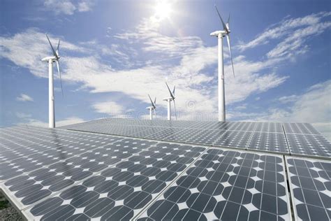 Solar Panels And Wind Turbine With Blue Sky Background Stock Image