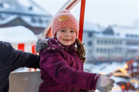 Little Cute Kid Girl Having Fun On Ferris Wheel On Traditional German