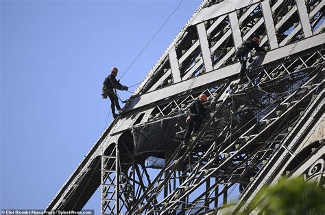 Cover Up Continues On The Eiffel Workers Put Paint On Pariss Iconic