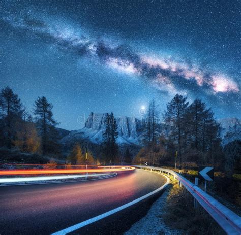 Milky Way Over Mountain Road Blurred Car Headlights Stock Image
