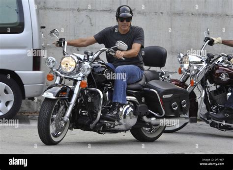 George Clooney Riding A Harley Davidson Motorcycle In Milan Milan Stock