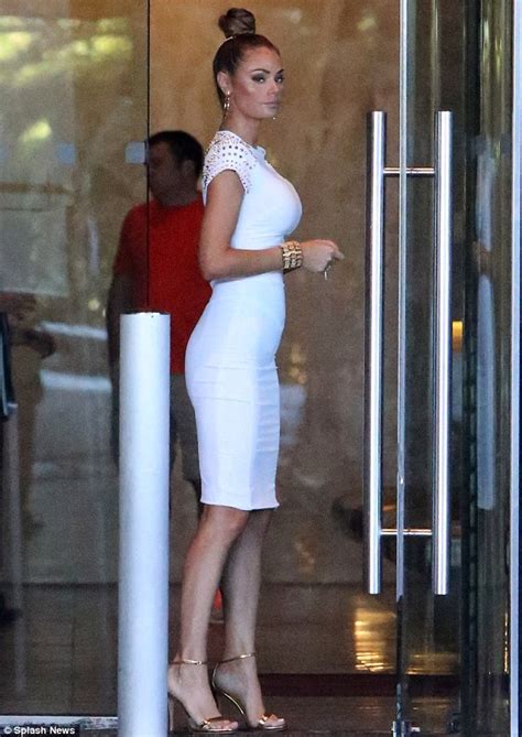 Chloe Sims Wears White Bodycon Dress And Tight Top Knot On Her Way To