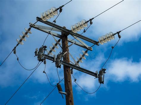 Close Up Of Insulator Power Lines Against Blue Sky Stock Image Image