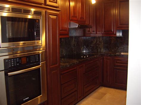 Wipe away the excess gel stain and continue applying and wiping away the excess until you finish staining the cabinets. Kitchen Cabinet Stain Colors - Home Furniture Design