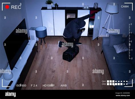 Cctv Video Surveillance Camera Showing Intruder Thief Stock Photo Alamy