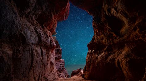 View Of Starry Night Through Beach Cave 4k Ultra Hd Wallpaper