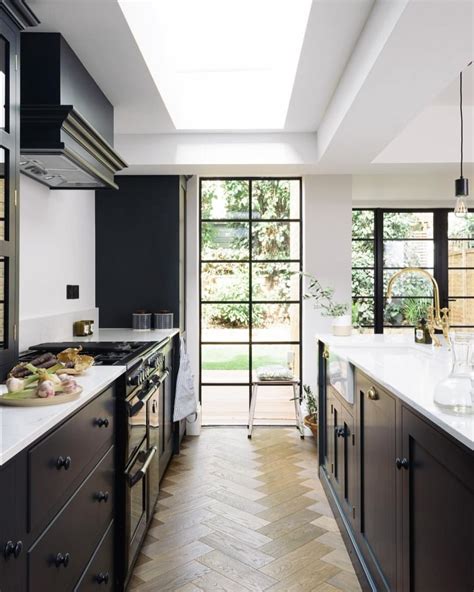 Crisp White Walls Deep Blue Cupboards Warm Brass Hardware