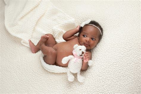 Newborn Baby Girl On Faux Sheepskin Blanket Stock Photo Image Of Hair