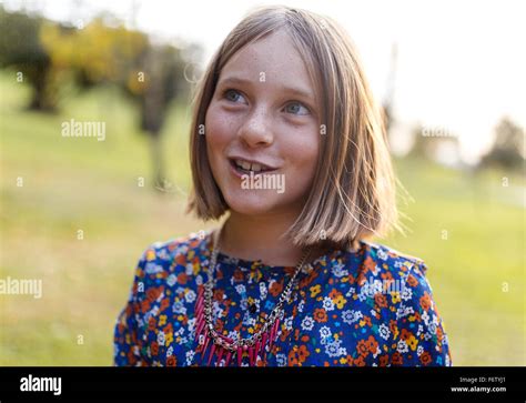 Portrait Of Smiling Blond Girl With Freckles Stock Photo Alamy