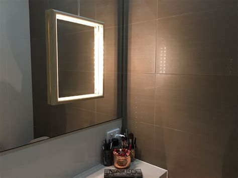 Paste puck lights around the mirror. How to add light to poorly lit bathroom vanity mirror ...
