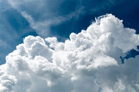 Incredibly Wonderful Lush Cumulus Clouds Against A Blue Sky Stock Image