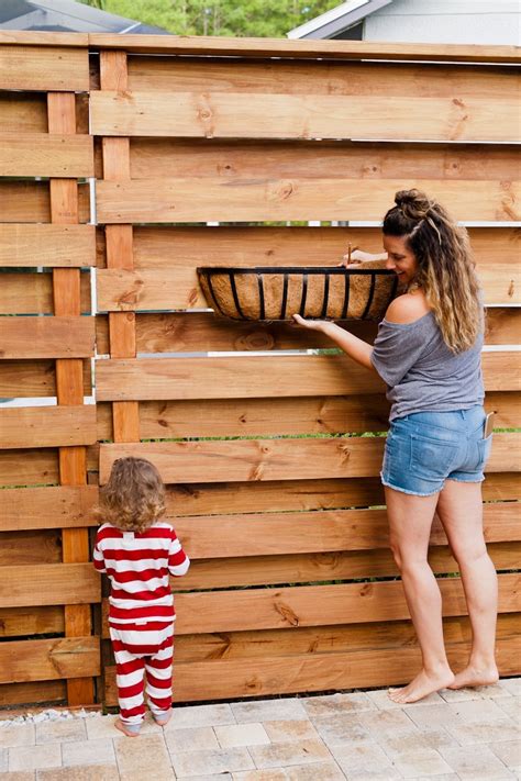 You can build an outdoor gate using fences. Stunning DIY Horizontal Slat Fence | Lifestyle | Fresh ...