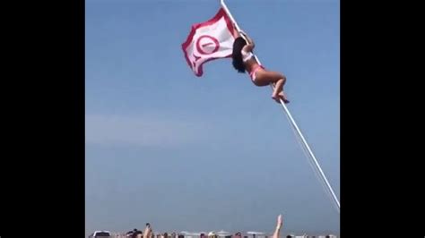 drunk girl climbs flag pole videoman