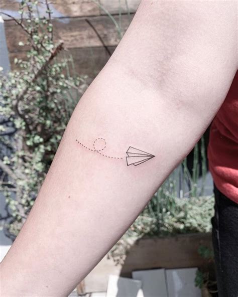 Paper Plane Tattoo On The Inner Forearm