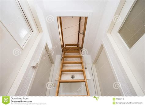 Wooden Staircase To The Attic In A Modern House Stock