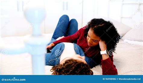 Lesbian Couple Interacting With Each Other On Bed Stock Footage Video