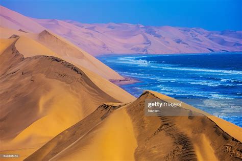 The Atlantic Ocean Moving Sand Dunes Namibia High Res Stock Photo