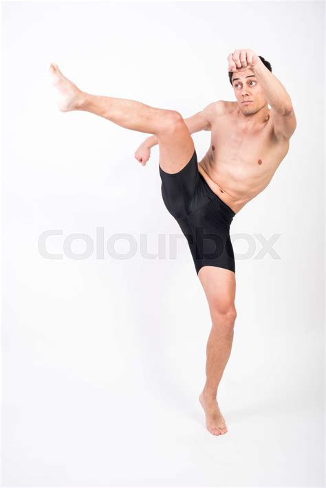 Shirtless Athlete Man Throwing A Kick In The Air Stock Image Colourbox