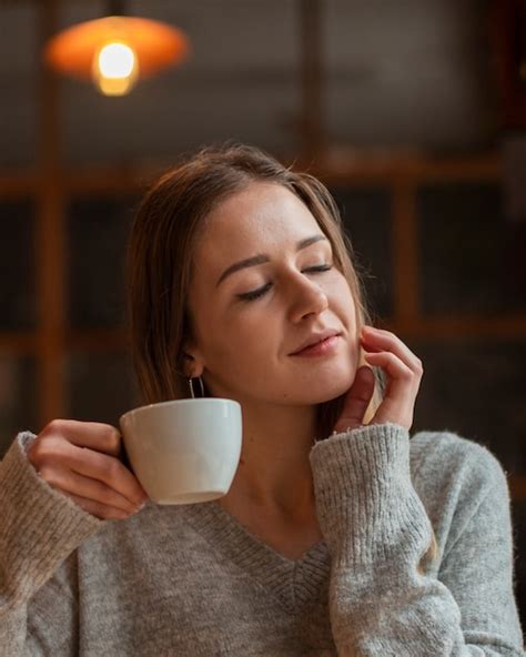 Free Photo | Beautiful woman enjoying cup of coffee