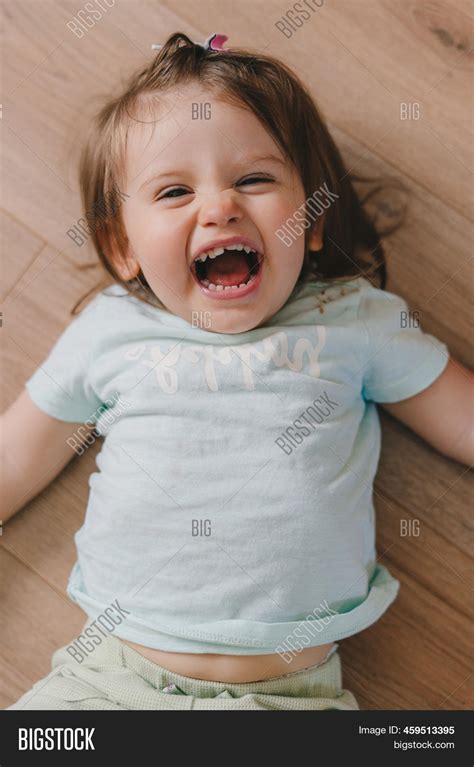 Laughing Girl Lying On Image And Photo Free Trial Bigstock