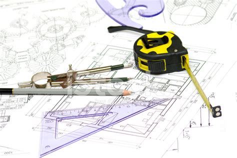 Tools And Papers With Sketches On The Table Technical Drawings Stock