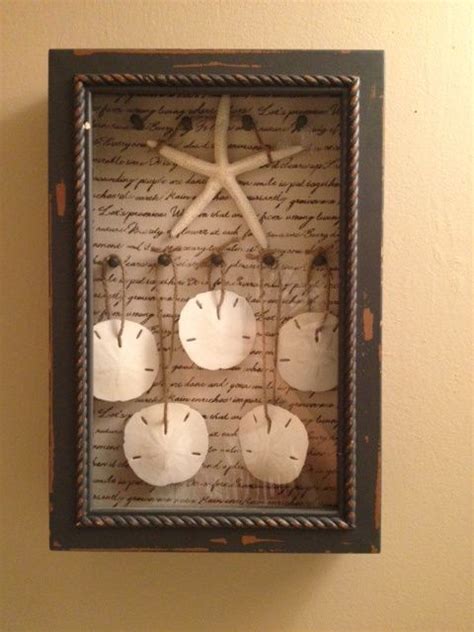We have a variety of large and framed sand dollar paintings, prints, and wall decor. Sand Dollar Shadow Box Home Decor | Sand dollar craft ...