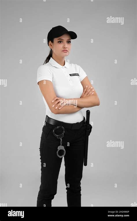 Female Security Guard In Uniform On Color Background Stock Photo Alamy