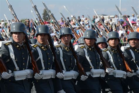 Chilean Army Soldiers In Traditional Uniforms Marching During A Parade