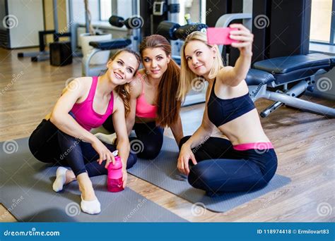 Happy Young Girls In Sportswear Taking Selfie In Gym Three Female