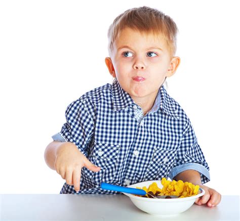 A Boy is Eating Cereal from a Bowl Stock Image - Image of studio ...